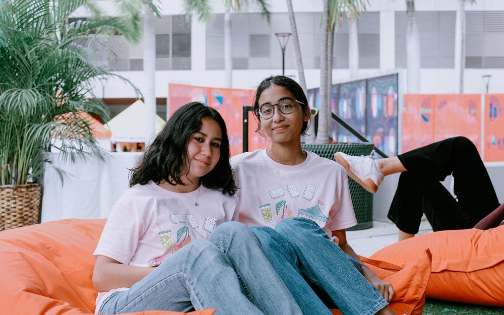 Girls sitting on a bean bag in Lizard Lounge at Children's Alley