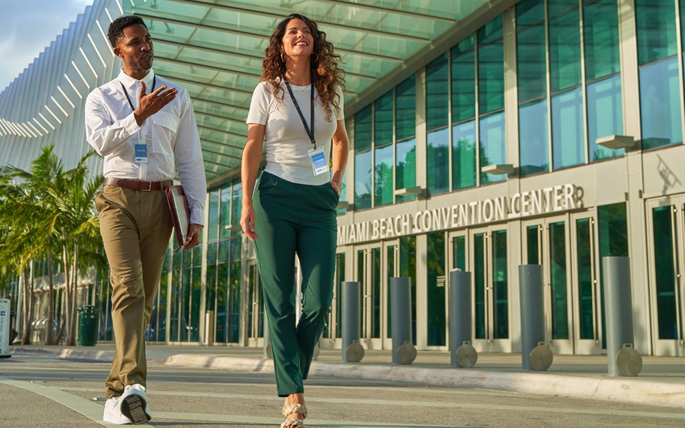 Meeting attendees in front of the Miami Beach Convention Center