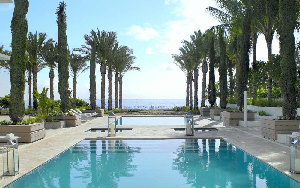 View of the pools and beach at the Grand Beach Hotel