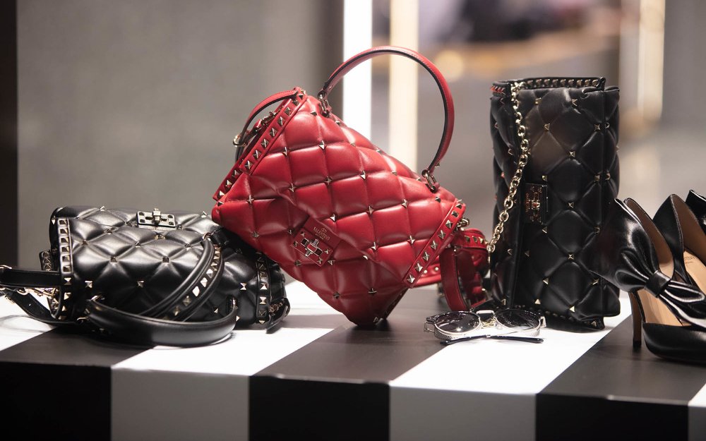 Shoes and purses displayed in a boutique window in the  Miami Design District