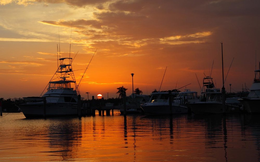 Sunrise behind the boats docked at Matheson Hammock Marina