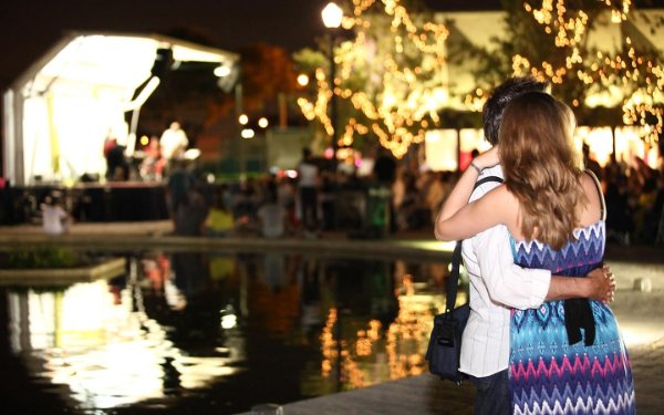 Couple watching a Jazz at MOCA outdoor performance